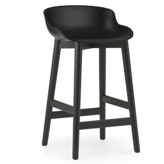 Normann Copenhagen Hyg black oak bar stool with polypropylene seat h. 65 cm. Normann Copenhagen Hyg Black - Buy now on ShopDecor - Discover the best products by NORMANN COPENHAGEN design